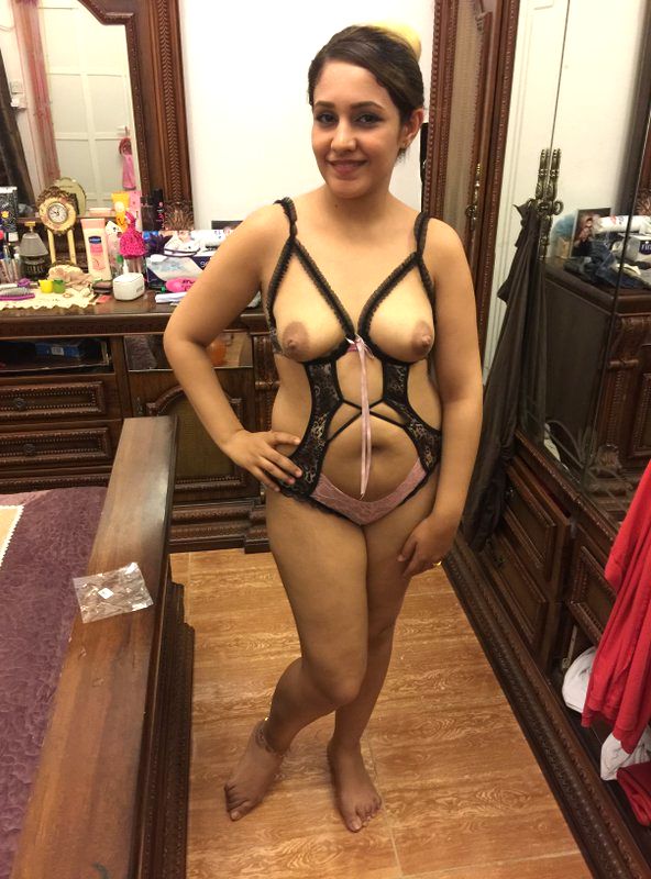 naughty housewife trying sexy lingerie for anniversary.