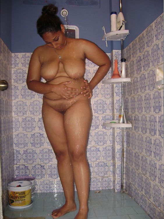 Big boobs woman taking shower