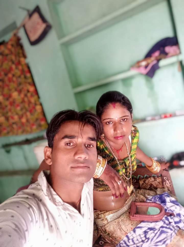 Village couple taking selfies