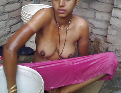 Village slim woman bathing outdoor