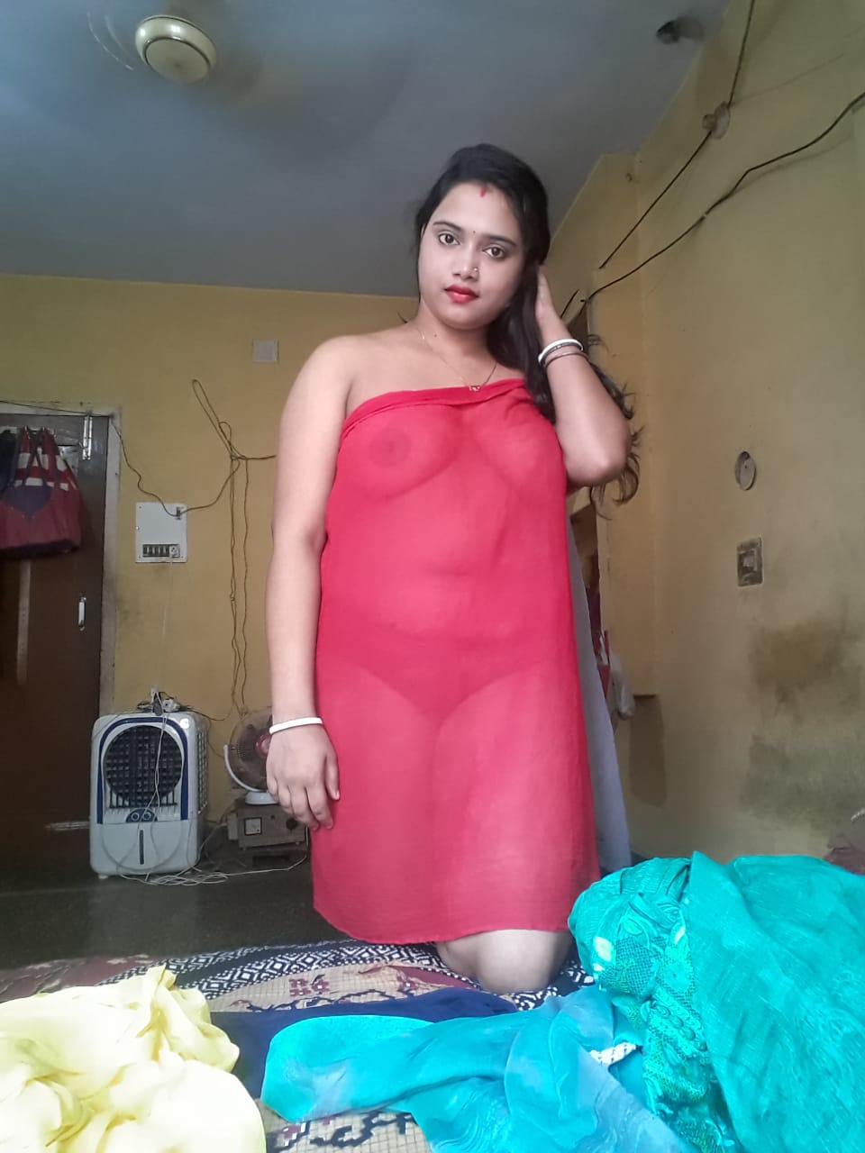 Wife draping red transparent fabric